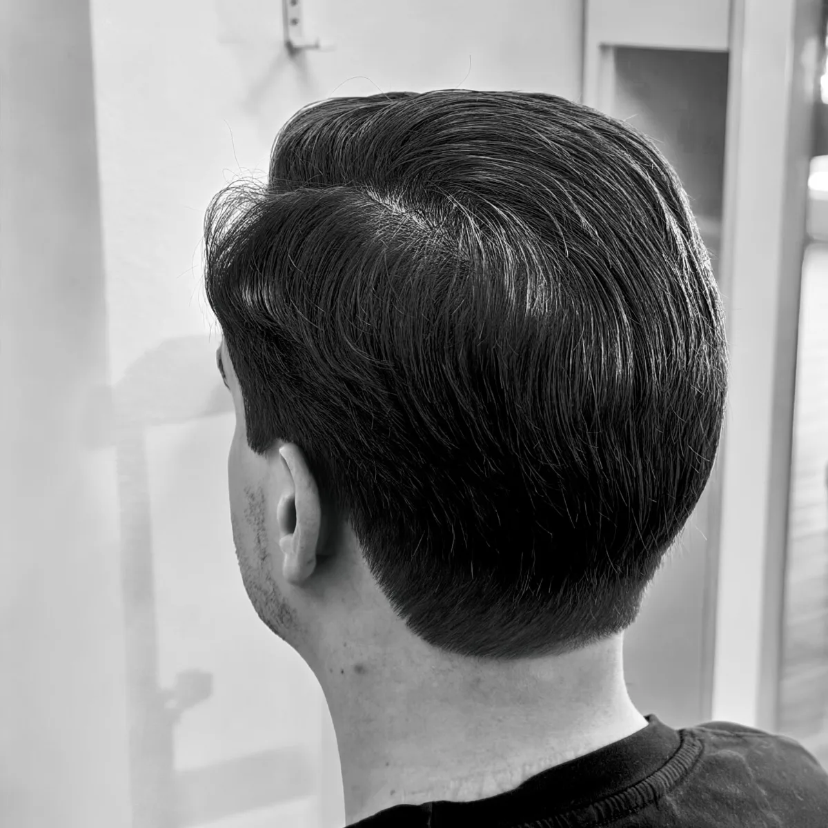 Back view of a classic taper with scissor work and a clean neckline, Irvine CA