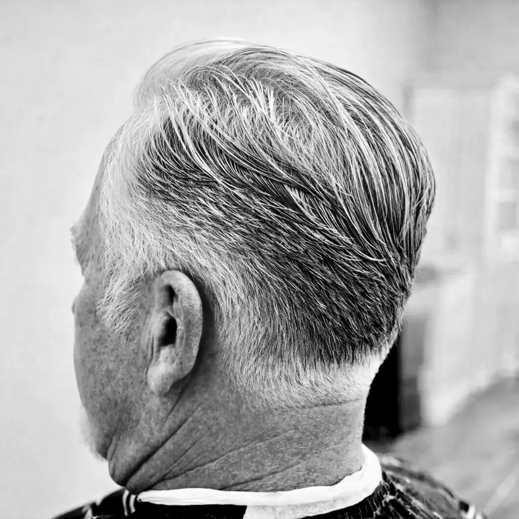 Classic men's haircut on grey hair with a soft natural taper, Irvine CA